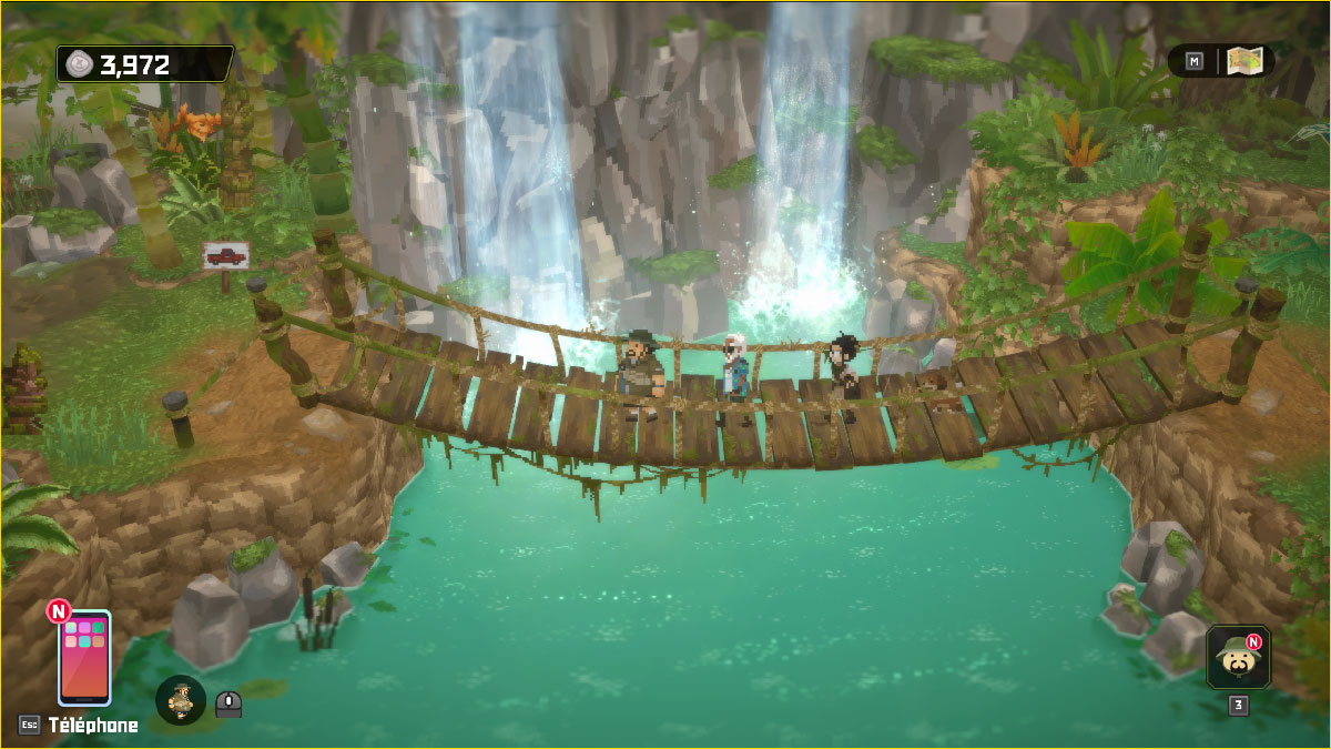 Un pont suspendu au-dessus de chutes d'eau dans la jungle d'In the Jungle