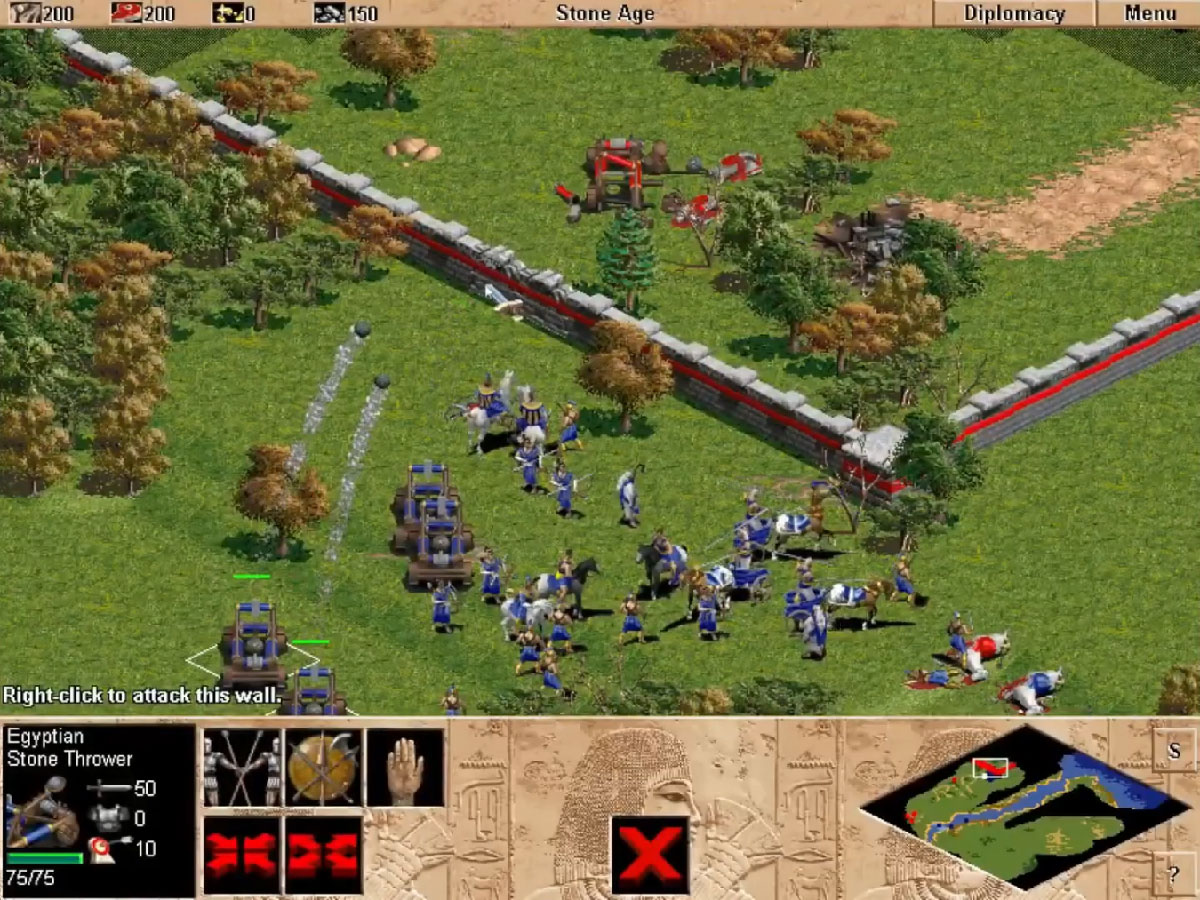 Armée avec catapultes détruisant des murs de fortification
