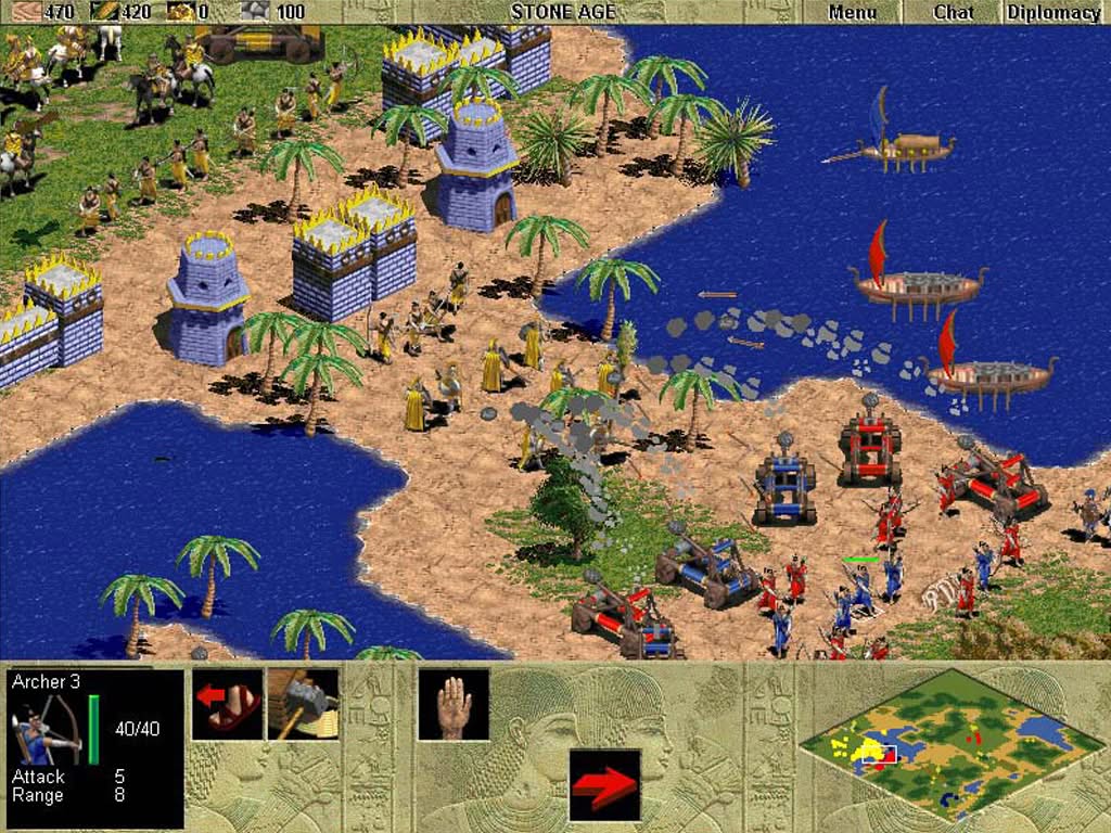 Age of Empires 1 original, battle with red and blue players attacking yellow player's fortress using catapults and warships