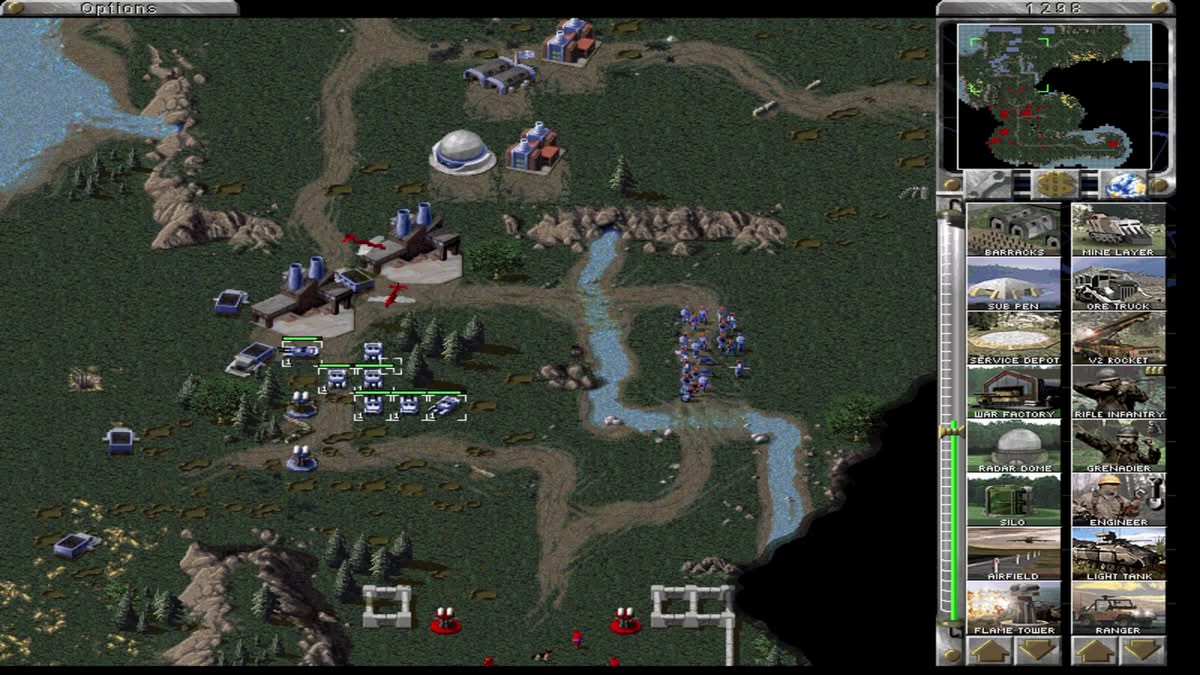Bataillon de tanks et de troopers attaquant une base fortifiée dans Red Alert