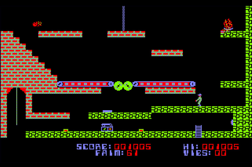 Capture d'écran du jeu Amstrad 6128+ Infernal Runner montrant de nombreux pièges mortels et le personnage joueur