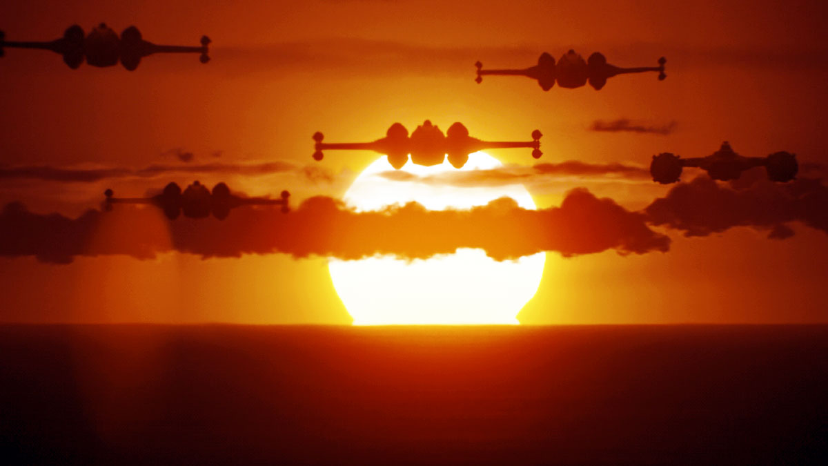 X-wings en plein vol devant un couché de soleil
