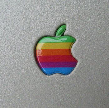 The 90s colorful Apple logo on a Macintosh screen, representing the era of General Magic foundation