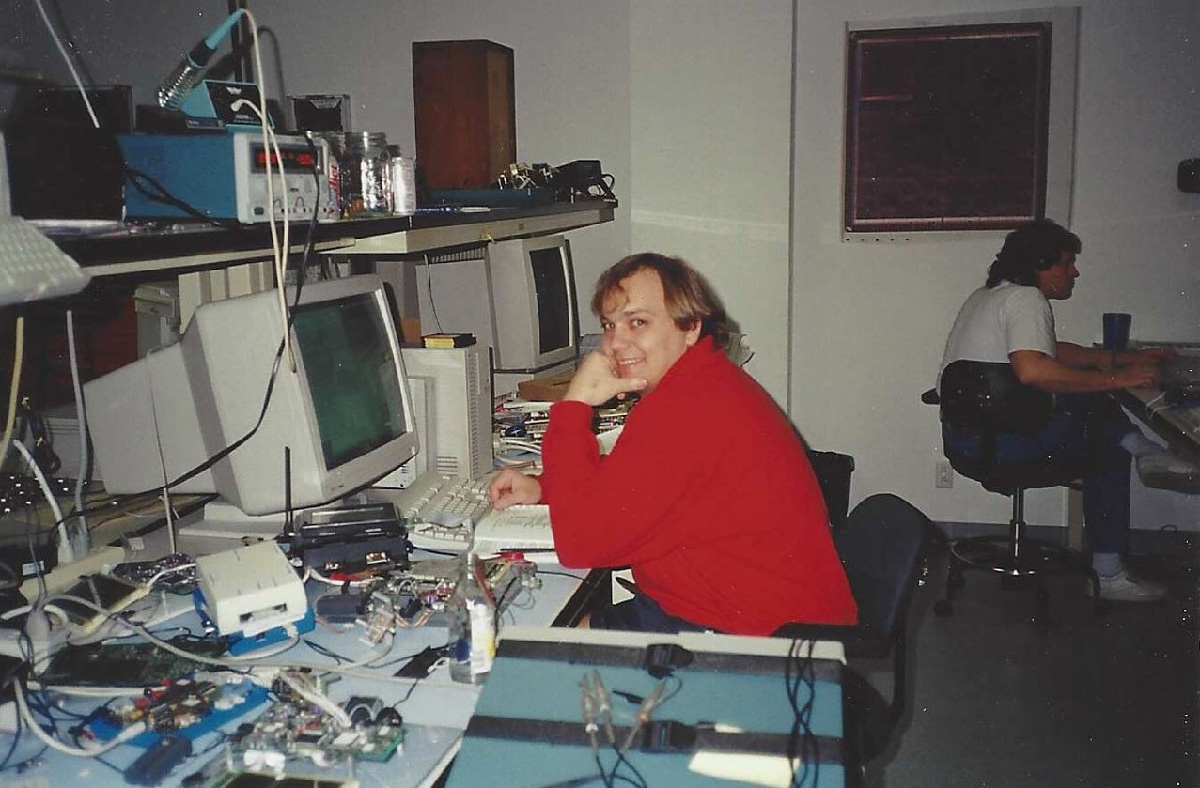 A young Tony Fadell at his desk inside General Magic, surrounded by early computer hardware